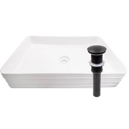 White porcelain vessel sink with rectangular shape and grooved exterior, designed for modern bathroom decor by Novatto.