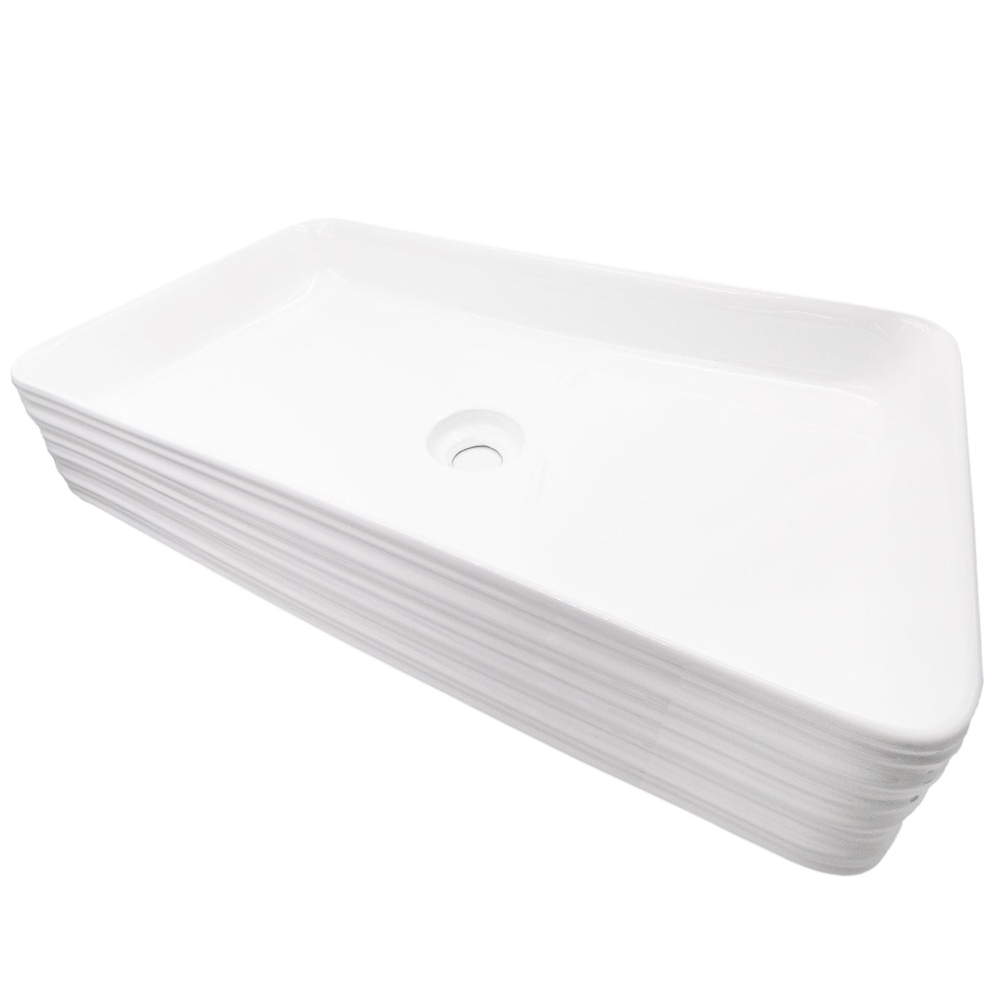 Rectangular white porcelain vessel sink with grooved exterior, designed by Novatto, shown from a side angle.