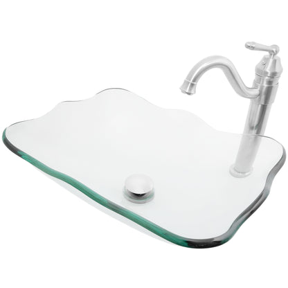 rectangular clear glass vessel sink with matching faucet and pop-up drain