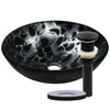 black and silver glass vessel sink with pop-up matte black drain