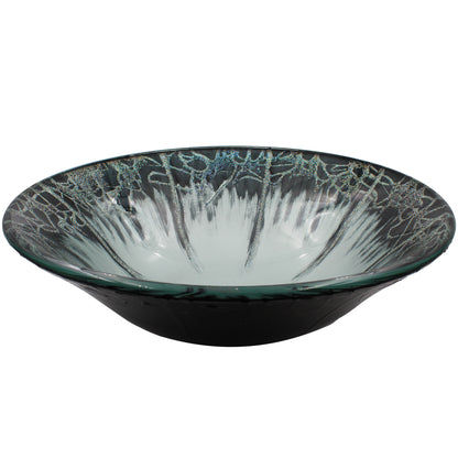 Modern round tempered glass vessel bathroom sink by Novatto, side view showcasing its sleek, artistic design.