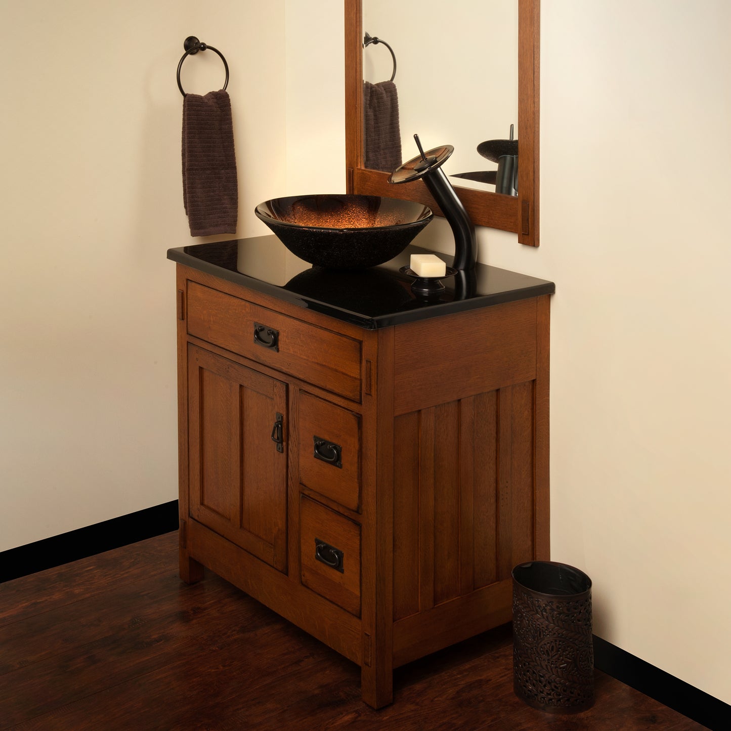Black and copper round glass vessel bathroom sink by Novatto, featuring a sleek transitional design and polished finish.