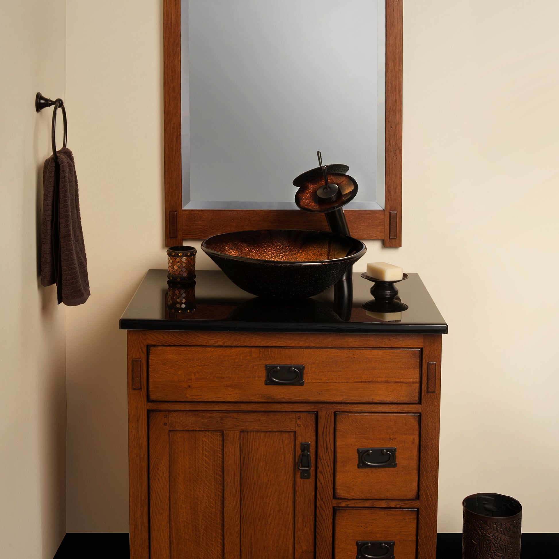 Black and copper round glass vessel bathroom sink by Novatto, featuring a sleek transitional design with a modern copper finish.