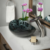 black and silver oval glass vessel sink lifestyle