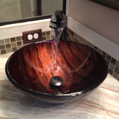 Hand painted brown camouflage glass vessel sink by Novatto, modern bathroom fixture with artistic design and smooth glass surface.