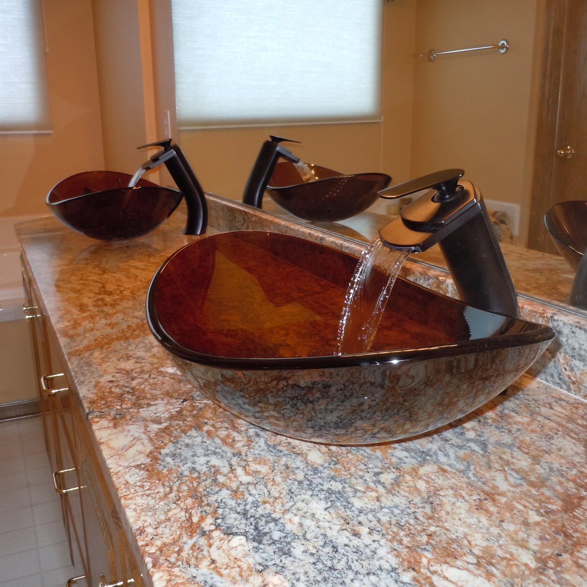 brown oval glass sink lifestyle