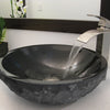 Round Black Granite Stone Bathroom Sink with matching faucet and umbrella drain lifestyle