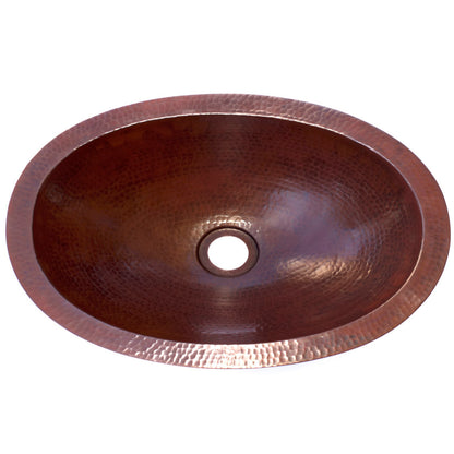 Oval copper undermount bath sink by Novatto, traditional bathroom style with antique finish, top view showing smooth interior and rim.