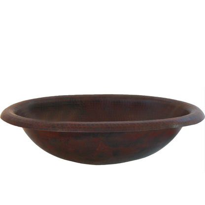 Small oval copper drop-in bath sink by Novatto, antique finish, transitional bathroom style, side view showing smooth oval shape.