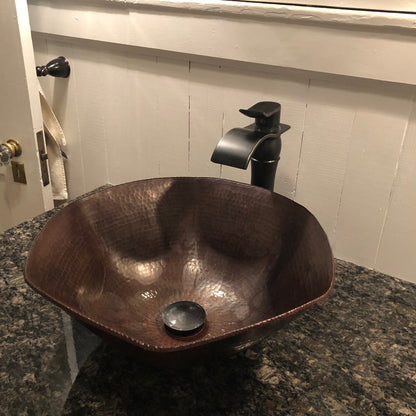 Traditional hammered copper vessel sink with scalloped edges in antique finish by Novatto, ideal for bathroom decor.