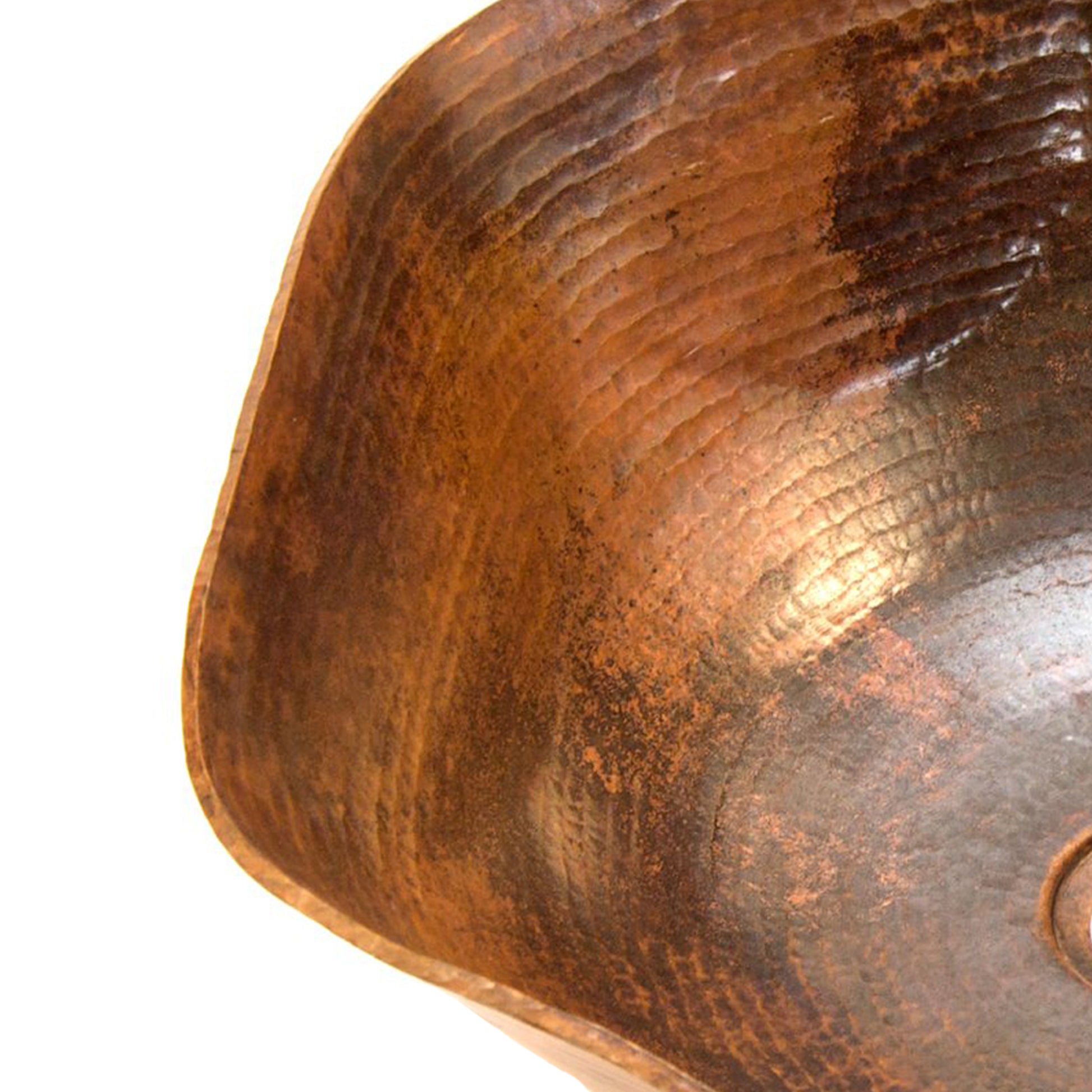 Traditional hammered copper vessel sink with scalloped edges, natural finish, by Novatto, shown from the left view.