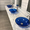 clear blue glass vessel sink lifestyle