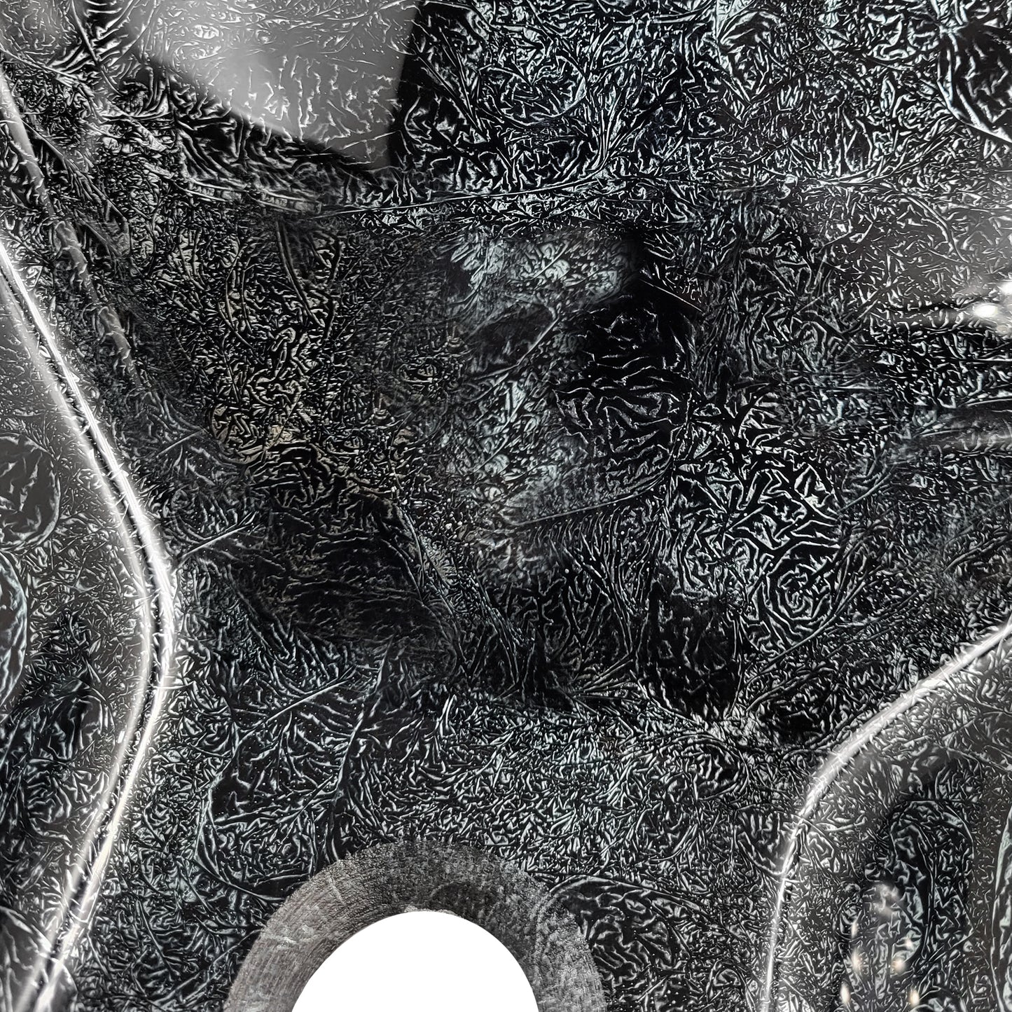 Modern black and silver hand foiled square tempered glass vessel bathroom sink by Novatto, shown in a close-up shot.