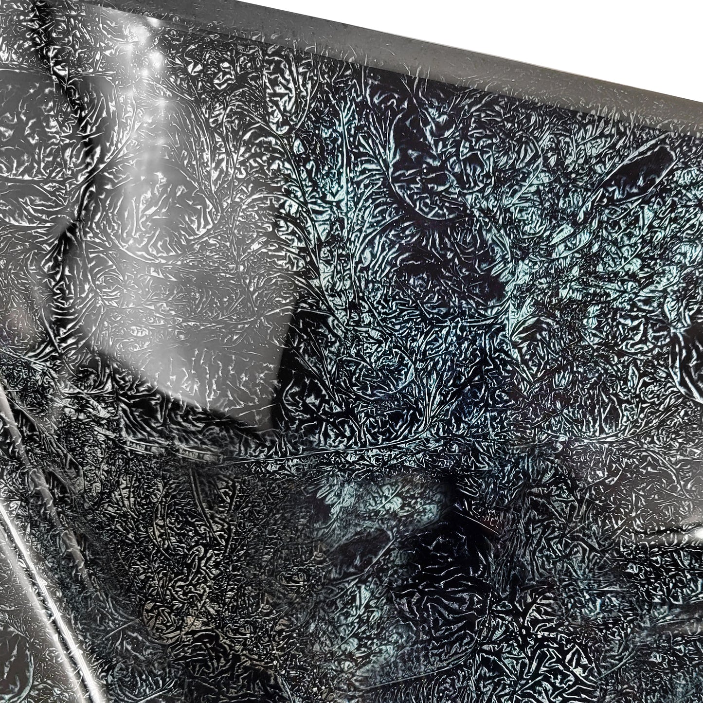 Close-up of Novatto Black Silver Hand Foiled Square Tempered Glass Vessel Bathroom Sink with textured surface.
