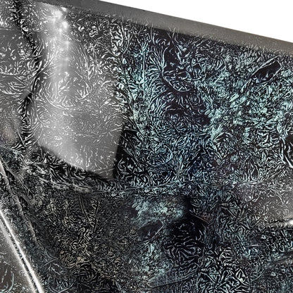 Close-up of Novatto Black Silver Hand Foiled Square Tempered Glass Vessel Bathroom Sink with textured surface.